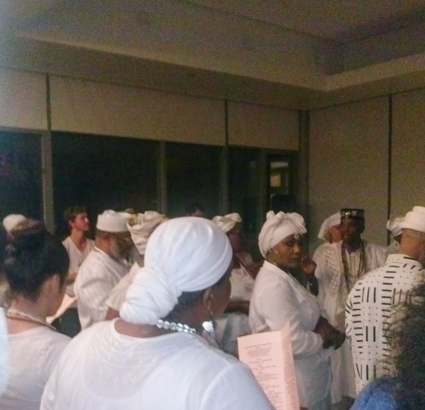 the community singing and dancing for Obatala