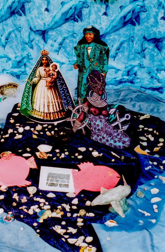 Detail of Ofrenda/altar-view of Yemaya-Olokun, La Virgen de la Regla, and Egun (ancestor) doll